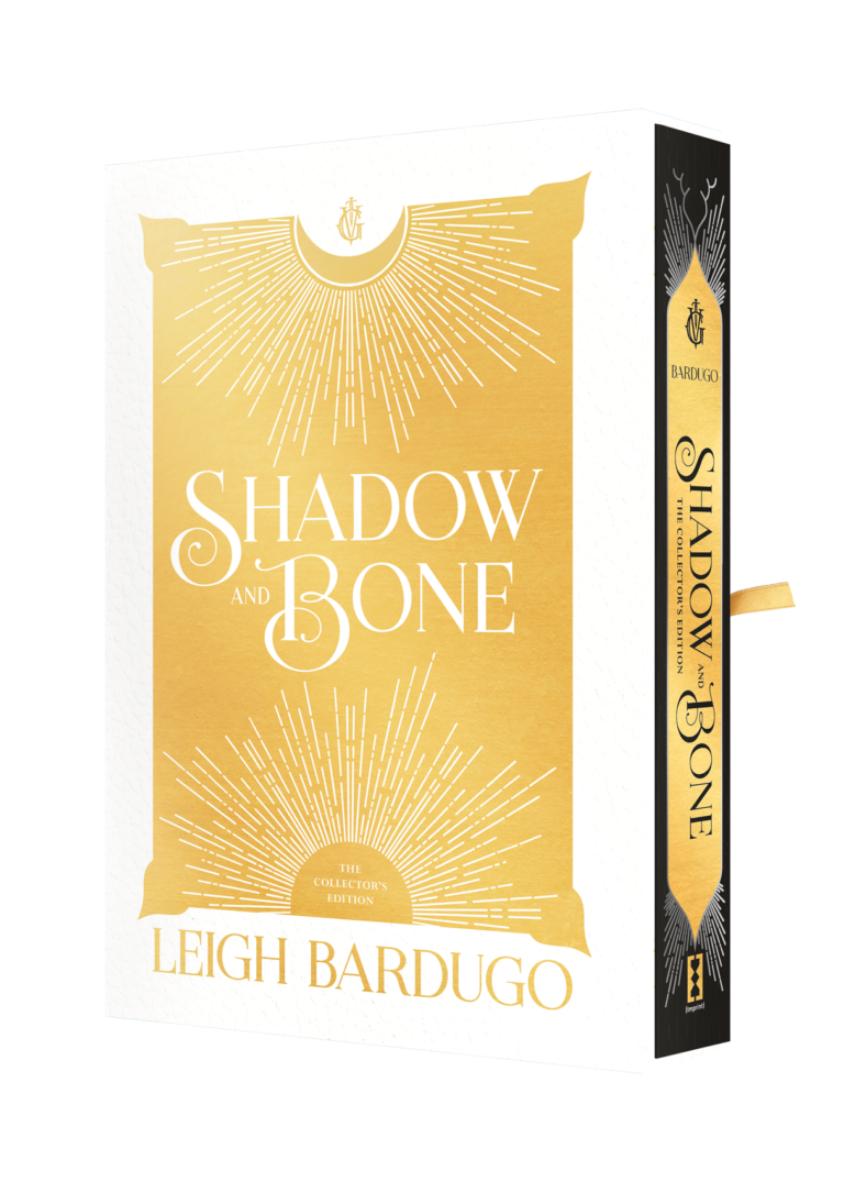 A cover the book "shadow and bone" by leigh bardugo, featuring a golden design of radiating lines on a cream background with the author's name at the bottom.